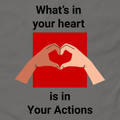 Flat lay of charcoal unisex tee with two hands forming a heart design - What's In Your Heart is in your actions by Ken Law Art