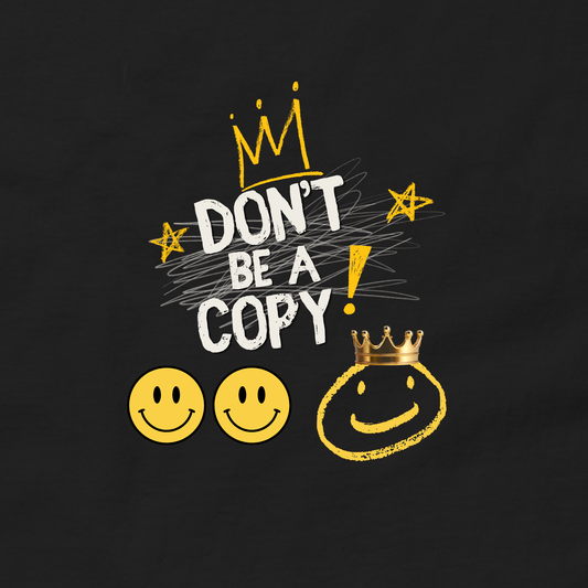 A black graphic print featuring the text 'DON'T BE A COPY!' in white and yellow, decorated with a gold crown, stars, and smiley faces.