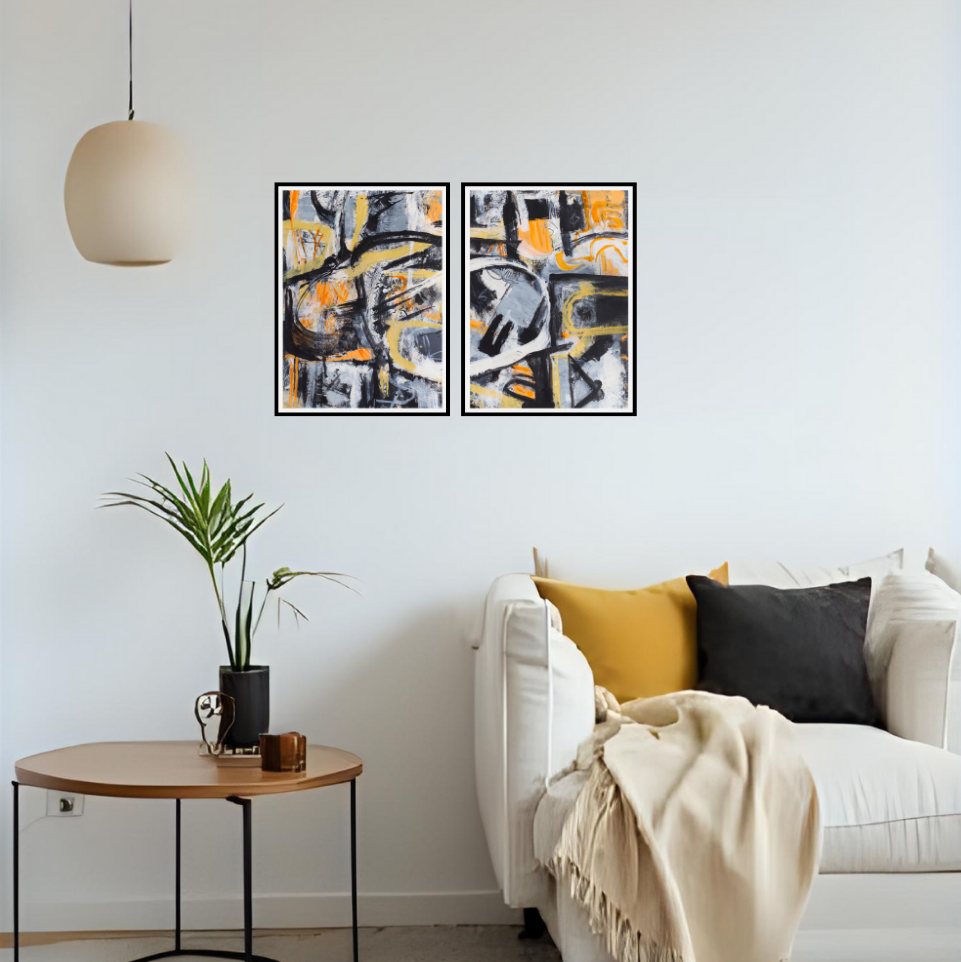 Modern living room with abstract art "I am one" Diptych framed as two artworks, a white sofa, and a small round table.