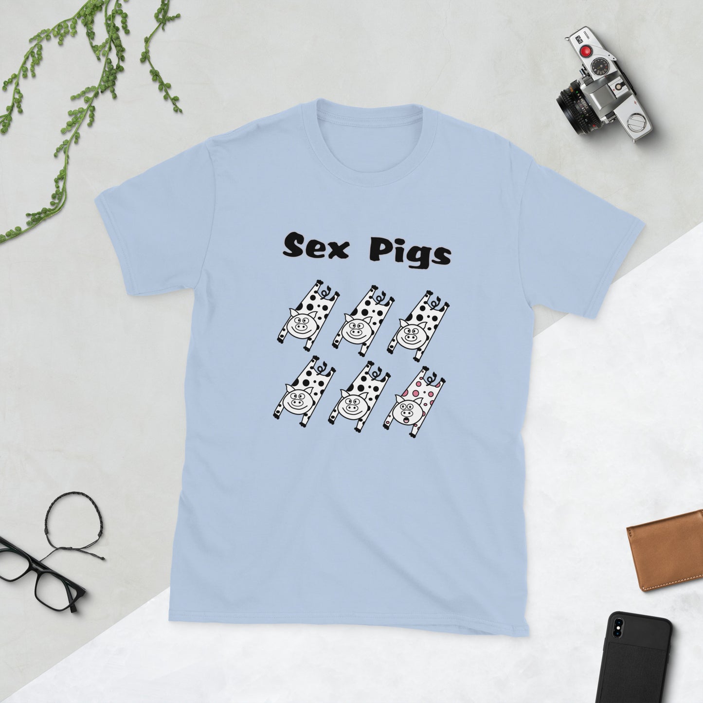 Light blue t-shirt with 'Sex Pigs' text and graphic design on a light gray background.