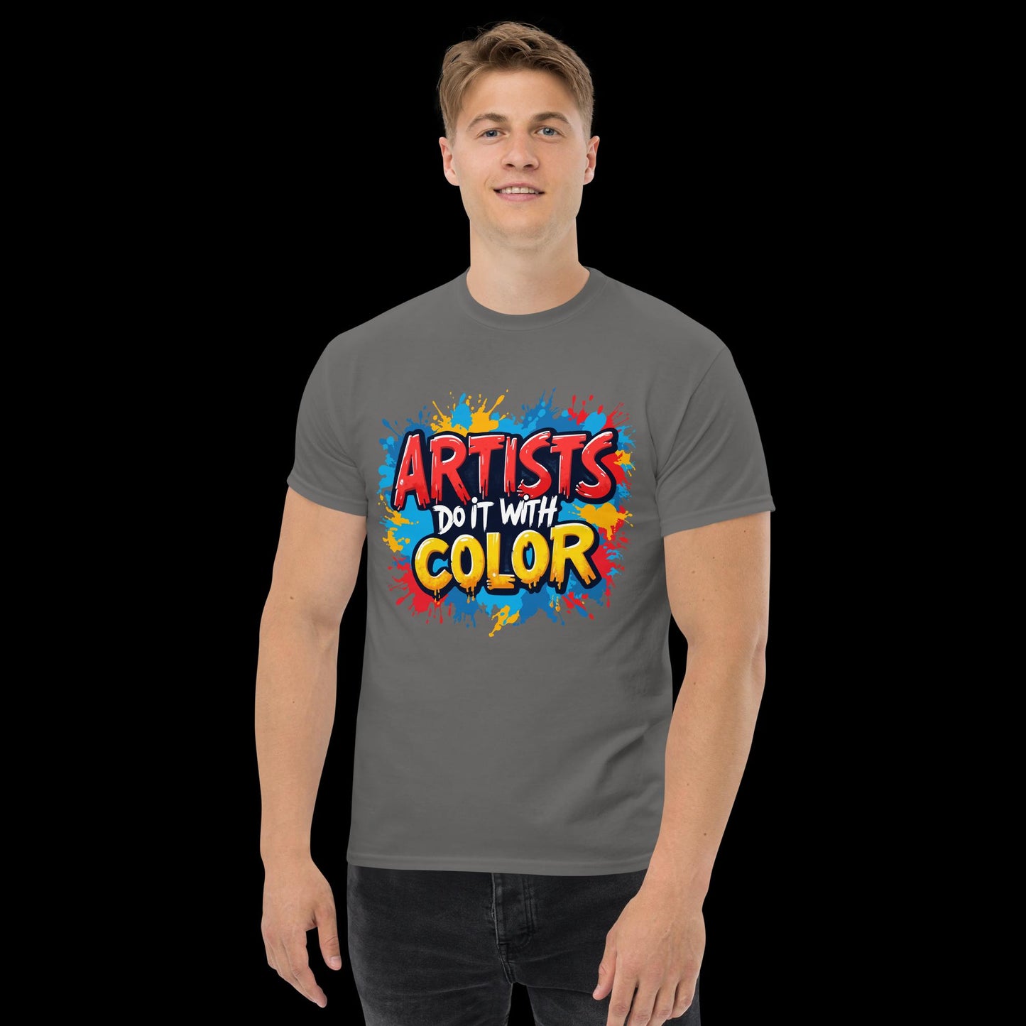 Person wearing a gray t-shirt with colorful text design on a black background