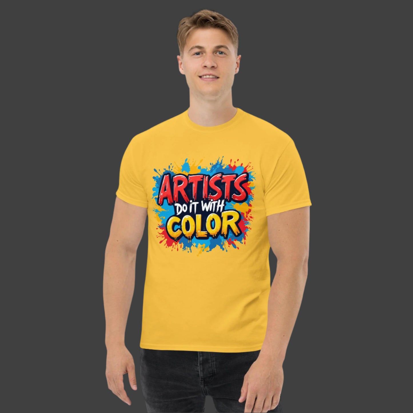 Person wearing a yellow t-shirt with 'Artists Do It With Color' text and colorful design.