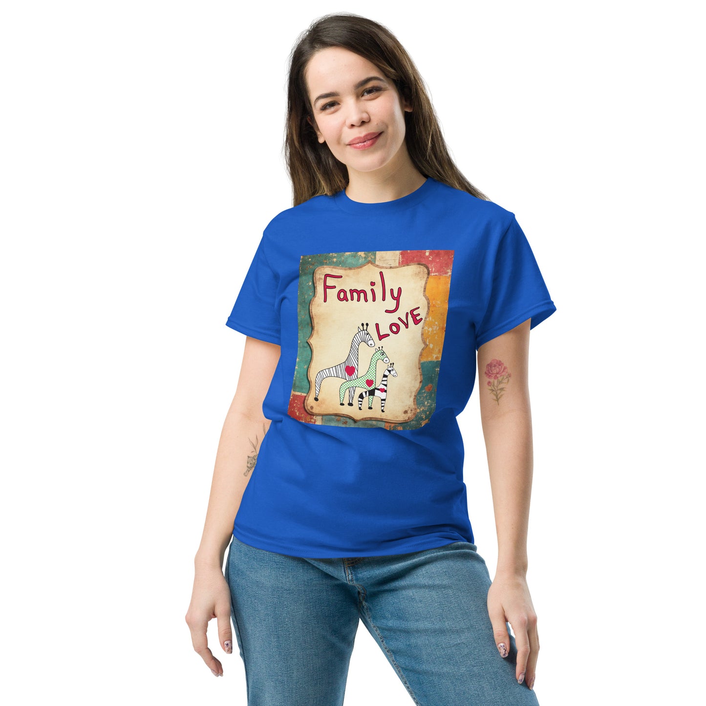 Woman wearing a blue t-shirt with a graphic design of giraffes and text on a white background