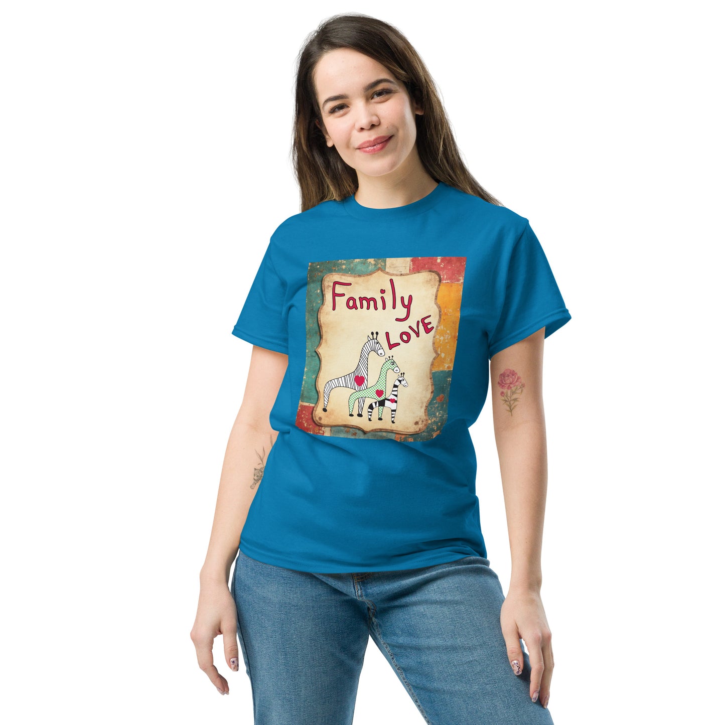 Woman wearing a blue t-shirt with a graphic design of giraffes and text on a white background