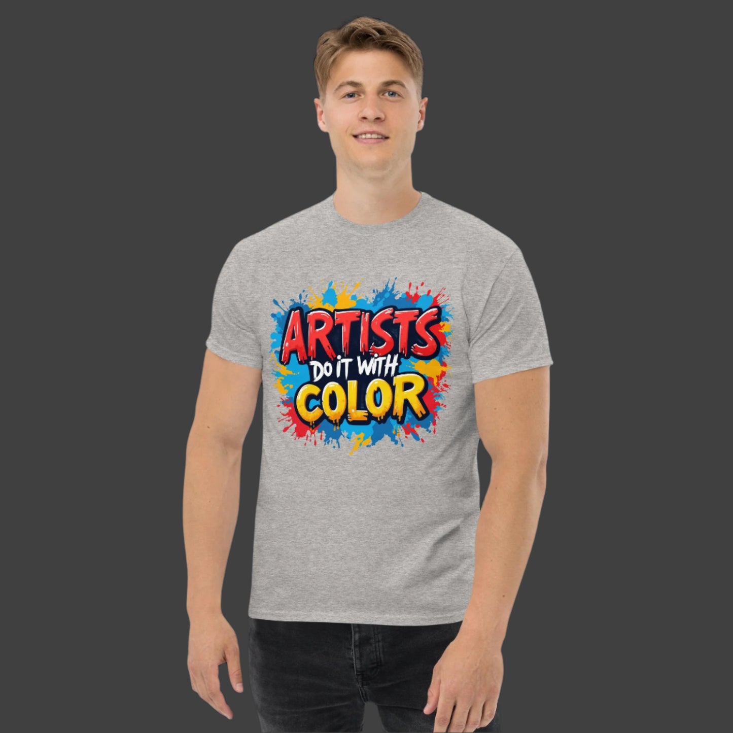 Person wearing a gray t-shirt with colorful text design on a black background
